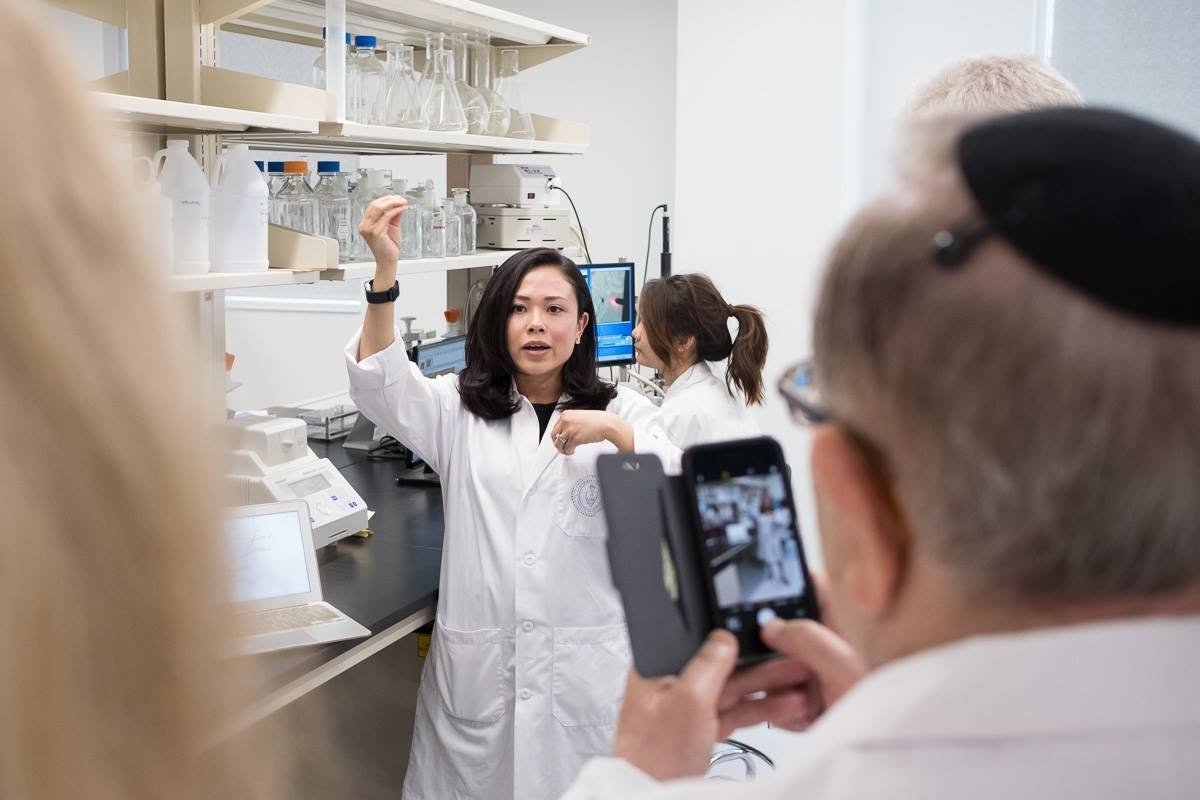Dr. Carneiro working in the lab